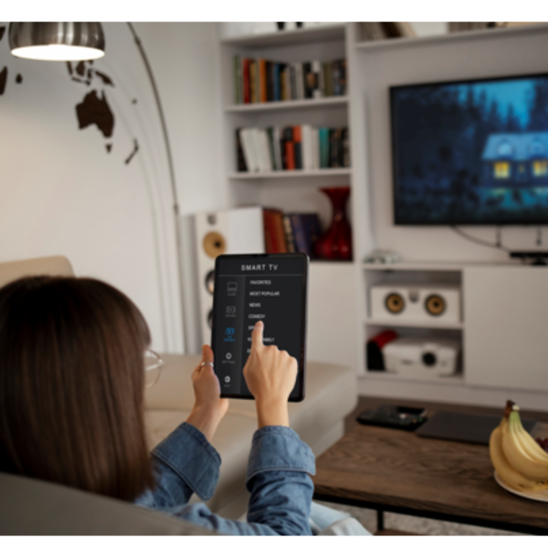 menina controlando os canais da TV através do tablet